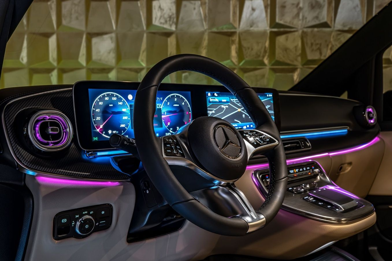 Interior of the 2025 V-Class with the round vents and ambient light.